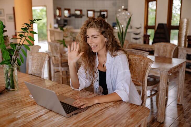 Woman Video Chatting in White Shirt